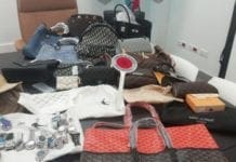 Capi ed etichette contraffatte nascosti in un trolley, maxi sequestro della Locale